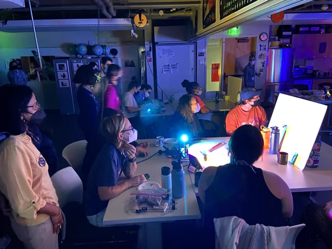 A group of educators admiring different colored shadows