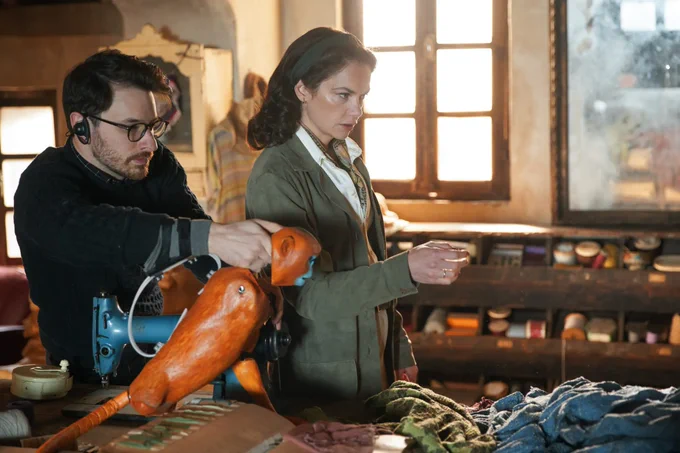 A Behind the scenes photo of Brian Fisher operating the monkey puppet alongside Ruth Wilson (Mrs Coulter) in His Dark Materials. 