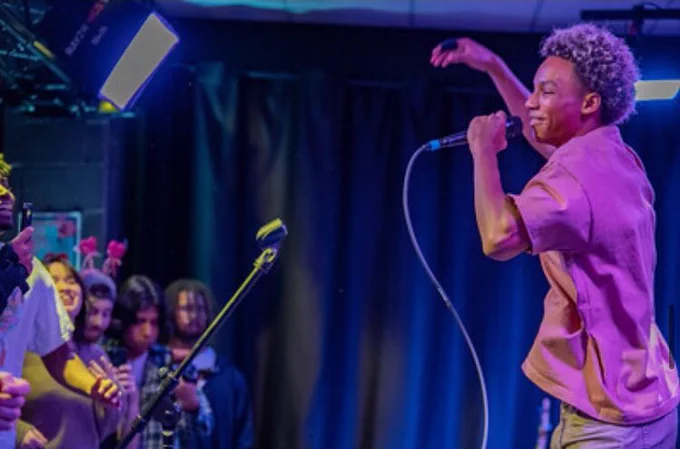Student performing with a microphone