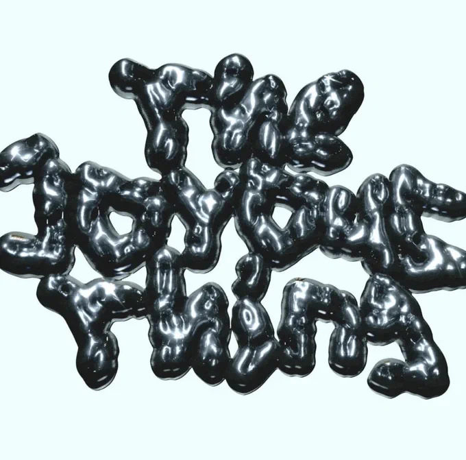 Bulbous 3-D wobbly text that reads ‘The Joyous Thing’ on a pale blue background.