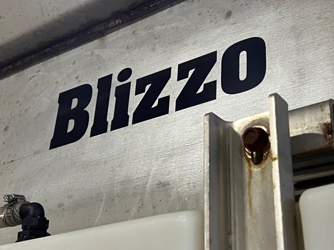 Close up of "Blizzo" on the newly named snowplow.