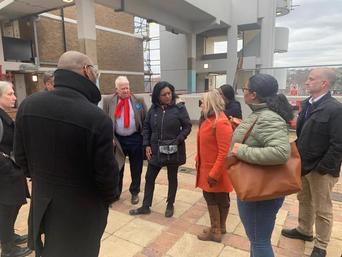 Janet Daby MP speaking with a group of people at Milford Towers.