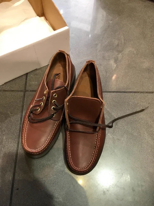 A pair of Russell Moccasin fishing oxfords. They look like brown camp mocs. 