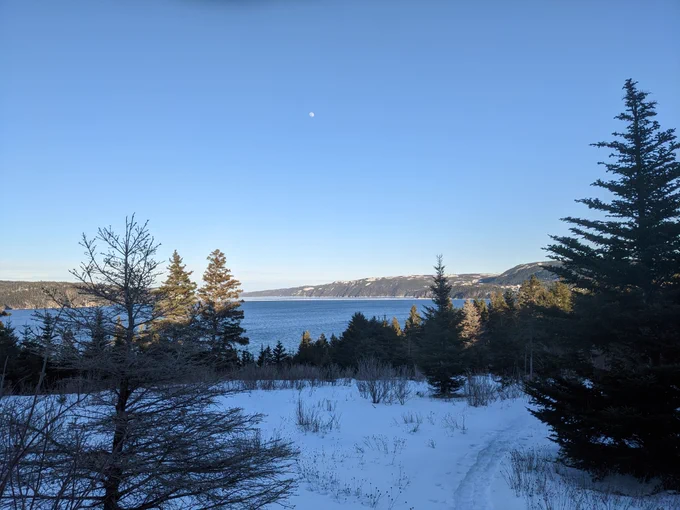 Early evening moon over Smith Sound near Petley, Random Island, NL.