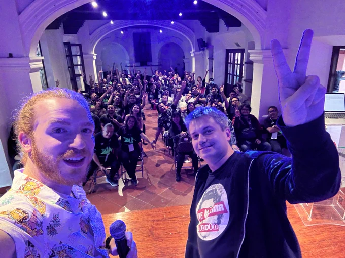 A selfie of Francesco and me on stage, with the audience in the background