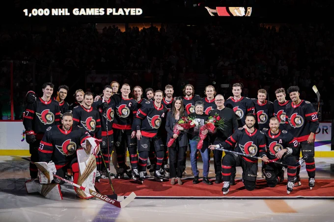 Derick Brassard is joined at centre ice by his parents and girlfriend along with all of his teammates to celebrate playing in his 1000th career NHL game.