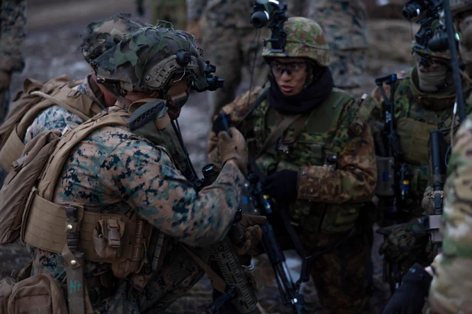 U.S. Marines with Battalion Landing Team 1/4, 31st Marine Expeditionary Unit, speak to soldiers from the 1st Regimental Landing Team, Japan Ground Self-Defense Force, during a night live-fire exercise for Iron Fist 23 in Hijudai, Japan, Feb. 22, 2023. The training allowed the U.S. Marines and soldiers from the JGSDF to share tactics and work together to secure an objective. Iron Fist is an annual bilateral exercise designed to increase interoperability and strengthen the relationships between the U.S. Marine Corps, the U.S. Navy, the JGSDF, and the Japan Maritime Self-Defense Force. 

U.S. Marine Corps photo by Sgt. Andrew King
