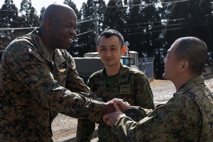 U.S. Marine Corps Sgt. Maj. Charles Peoples, the 31st Marine Expeditionary Unit's senior enlisted advisor, left, shakes hands with Amphibious Rapid Deployment Brigade senior enlisted advisors during a sergeant major symposium for Iron Fist 23 at Hijudai, Japan, Feb. 17, 2023. The meeting allowed the leaders to build relations and share best practices on the development and guidance for the Marines and soldiers under their command. Iron Fist is an annual bilateral exercise designed to increase interoperability and strengthen the relationships between the U.S. Marine Corps, the U.S. Navy, the Japan Ground Self-Defense Force, and the Japan Maritime Self-Defense Force. 

U.S. Marine Corps photo by Lance Cpl. William N. Wallace