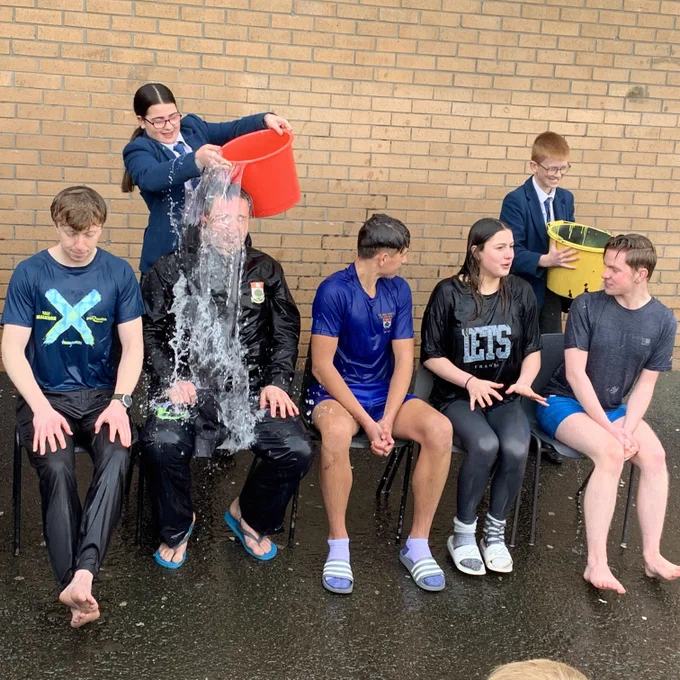 Staff and pupils getting soaked, for Clyde House Fundraising Week.