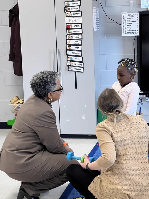 Commissioner Allen-McMillan talks with an NBTSchools preschooler. 