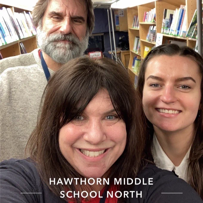 IMAGE: Three Bookmobile staff members smiling for the camera. TEXT: Hawthorn Middle School North