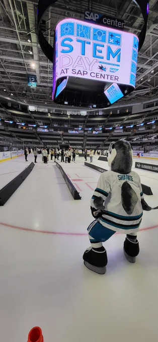 Sharkie playing with kids on the ice for STEM day