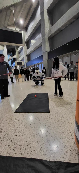 Sharkie teaching the kids how to slapshot