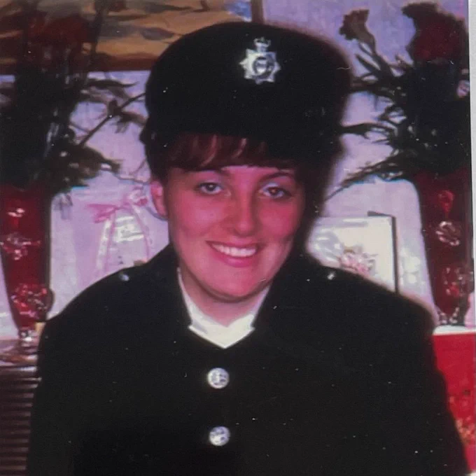 Alison Jones, the first female Federation Rep, pictured in her uniform comprising a tunic with embossed silver coloured buttons and flat hat