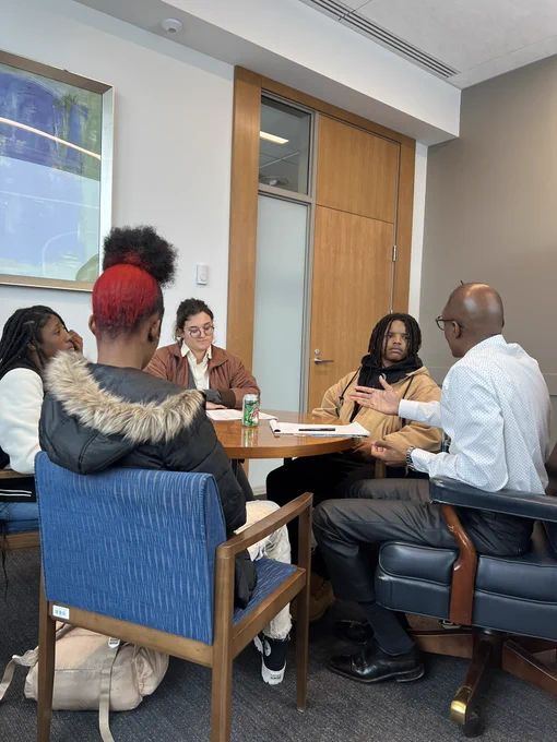 Senator Champion and 4 members of Appetite for change discussing hunger solutions for their community.