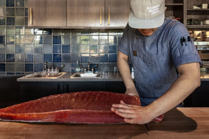 Chef cutting fish
