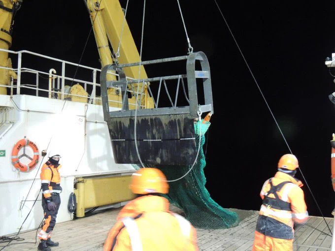 The Agassiz trawl being deployed at night