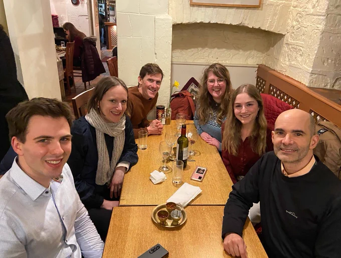 Six people having dinner at a restaurant