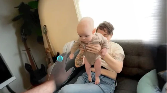 A memory of McHugh and his child in his living room