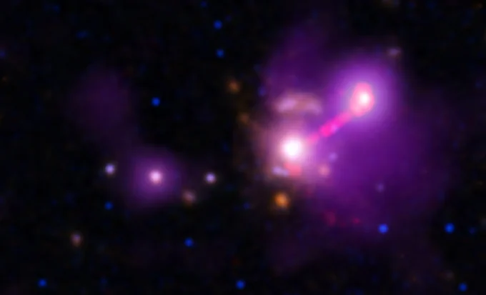 The galaxy called 3C 297 is rendered in purple against a starry background