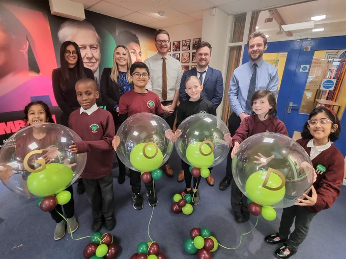 Image shows Pupils from Woodthorne Primary School celebrating their Good Ofsted rating with Councillor Chris Burden, Cabinet Member for Education, Skills and Work.