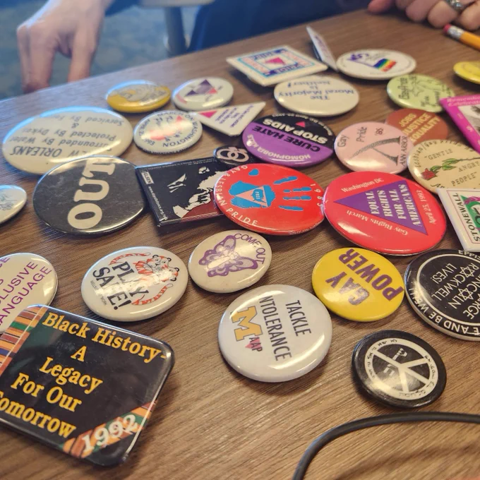 A collection of pins from LGBTQIA  and Black activist movements new to the Labadie collection, from the James Toy estate. 