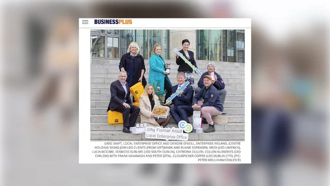 enterprise Week launch photography by Coalesce for use in all online and print media. group shot of business people with props on steps in Dublin