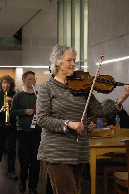 Musician playing in the Arts Tower as part of a parade