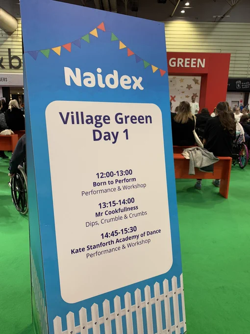A sign advertising the day one of events at Naidex on the village Green area at the nec