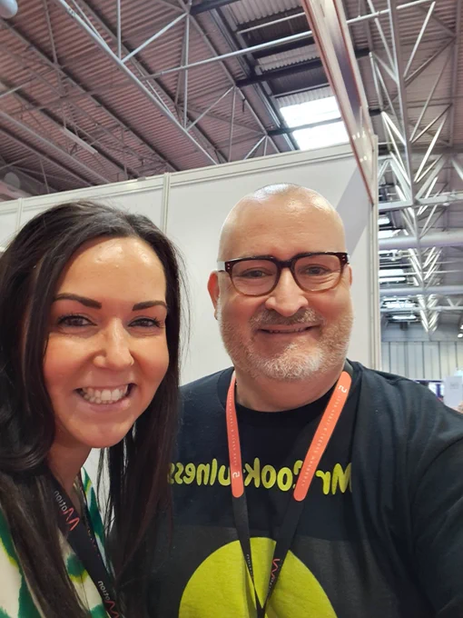 In this photo is Ian Taverner, Mr Cookfulness, and Ros Tulloch, the editor of PosAbility Magazine.  We are in the main hall at the Naidex show