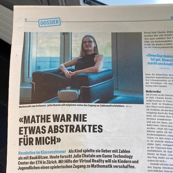 Picture of the newspaper Tages Anzeiger including a picture of Julia Chatain next to a VR headset, as well as the title of the article “Mathe war nie etwas abstraktes für mich”