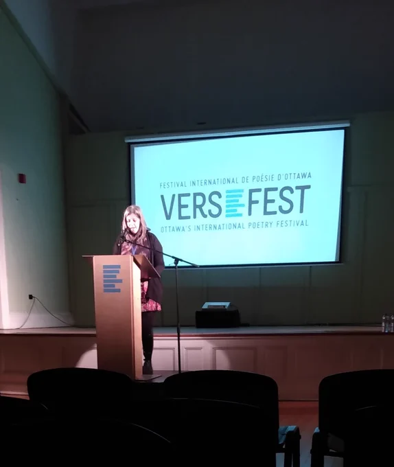 Vivian Vavassis reading at the podium.
