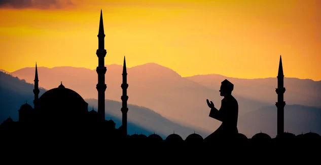 Islamic towers and praying man