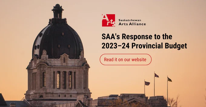 The Saskatchewan Legislative Building at sunset. On the right is the Sask Arts Alliance logo, and underneath it in bold, black text reads "SAA's Response to the 2023–24 Provincial Budget." In a red-outlined pill shape is red text that reads "Read it on our website." End. 