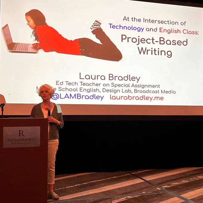 Laura stands in front of a giant screen: "At the Intersection of Technology and English Class: Project-Based Writing;
Laura Bradley, Ed Tech Teacher on Special Assignment"