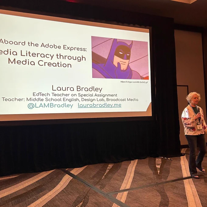 Laura stands in front of a giant screen: "All Aboard the Adobe Express: Media Literacy through Media Creation; Laura Bradley, Ed Tech Teacher on Special Assignment"