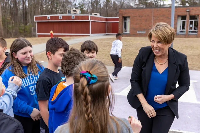 Governor Healey plays basketball with Hajjar Elementary students at recess. 