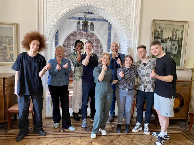 Group of 9 people inside the British Ambassador’s Residence in Algiers: Kameel Myrie, HMA Sharon Wardle, Warren Murray, Neil Webb, Cat Sheridan, Hamza Koudri, Rachael Veazey, Ben Randall and Billy Read