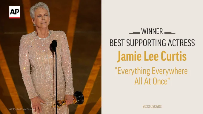 Jamie Lee Curtis accepts the award for best performance by an actress in a supporting role for "Everything Everywhere All at Once" at the Oscars.