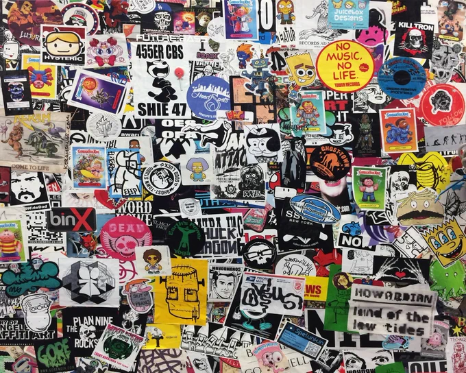 Big amount of stickers covering a surface. Meaning of this picture: "Many labels carry much information, not only for the AI." Image by Marc Newberry, Unsplash. 