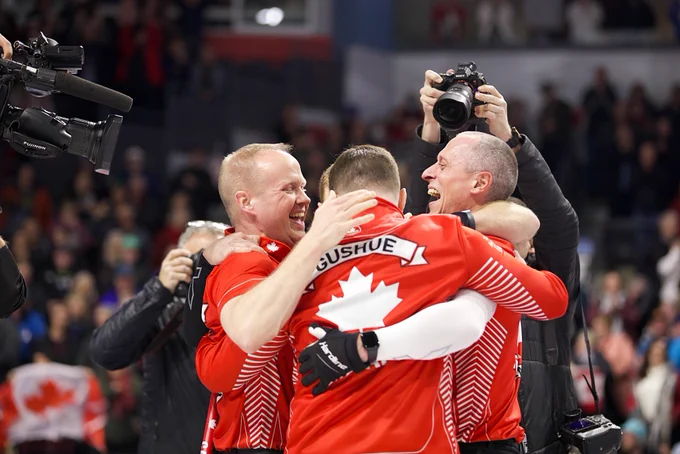 Mark Nichols, Brad Gushue, and EJ Harnden celebrate their Brier victory.
Photo credit: Anil Mungal / The Curling News