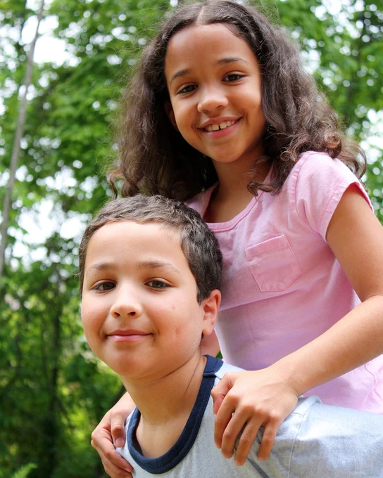 Two children smiling