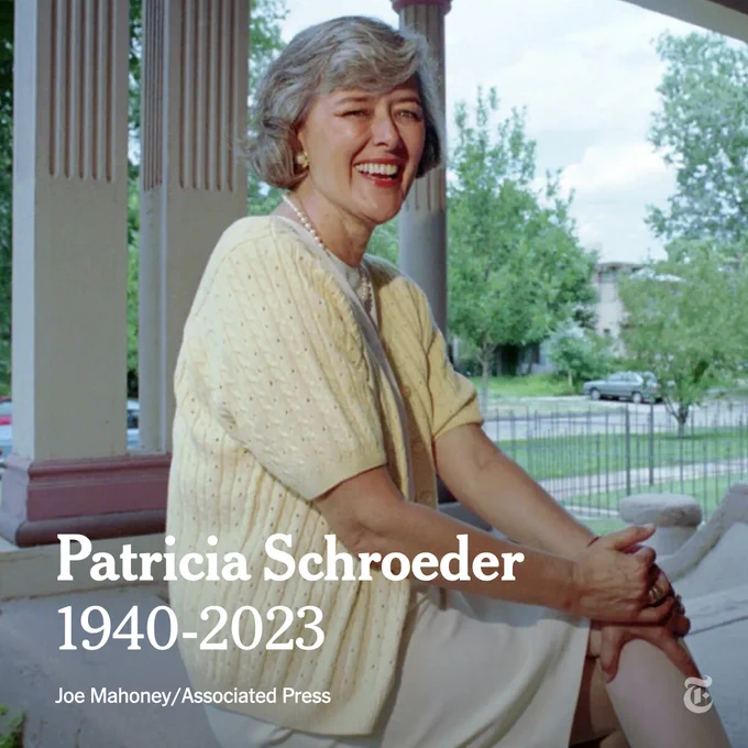 Representative Patricia Schroeder sits cross-legged wearing a dress and yellow sweater in a photo from 1994. Photo credit: Joe Mahoney/Associated Press