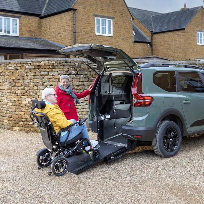 One of the first customers using the Dacia Jogger Wheelchair Accessible Car in Dusty Khaki colour. The conversion enables wheelchair access via a lightweight, counterbalanced ramp (shown in the image). By lowering the floor, Sirus Automotive has been able to achieve a seated head height of 139cm with the Dacia Jogger's space and generous headroom ensuring a wheelchair user can sit comfortably.