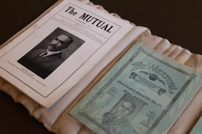 Copies of "The Mutual" and "The Whetstone." both look like early 20th century publications and feature Black men on the cover. 