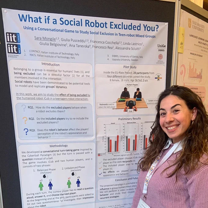 Sara Mongile in front of the poster for her LBR by the title "What if a Social Robot Excluded You? Using a Conversational Game to Study Social Exclusion in Teen-robot Mixed Groups"