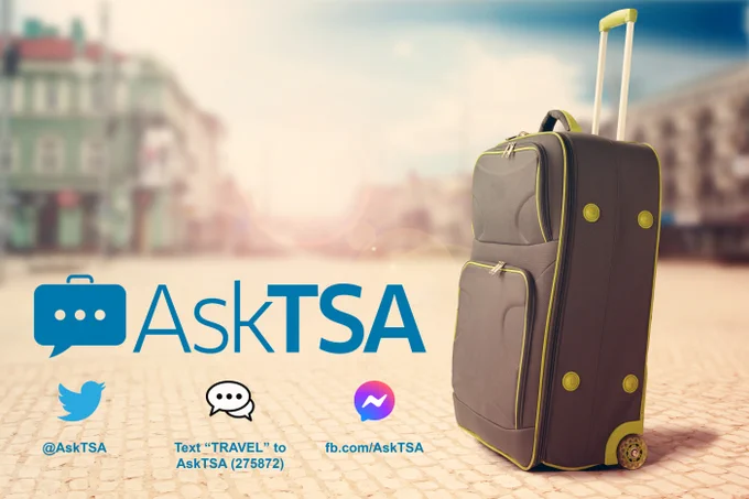 AskTSA on Twitter @AskTSA, SMS - Text Travel to AskTSA (275872), Facebook messenger at fb.com/AskTSA. Image contains a piece of luggage on a brick courtyard, appearing to be somewhere in Europe.
