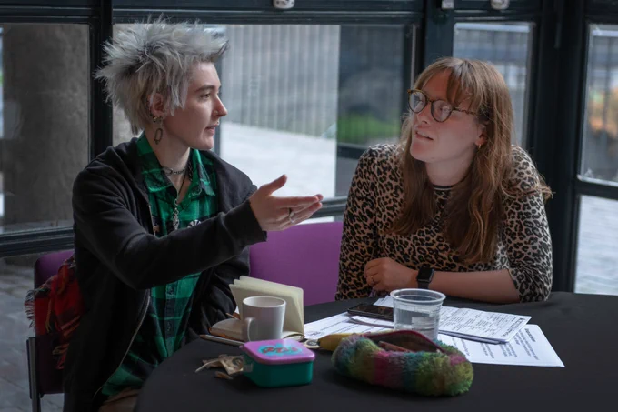 Fellows at the Curating for Change residential event, taking notes, discussing and watching presentations. Credit: Museum of London