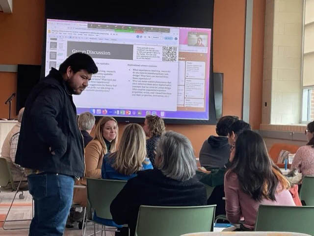 Saul Barbosa and Kristen Vroom talking with attendees at the Co-Integrate session in CREATE on 3/16/23. 