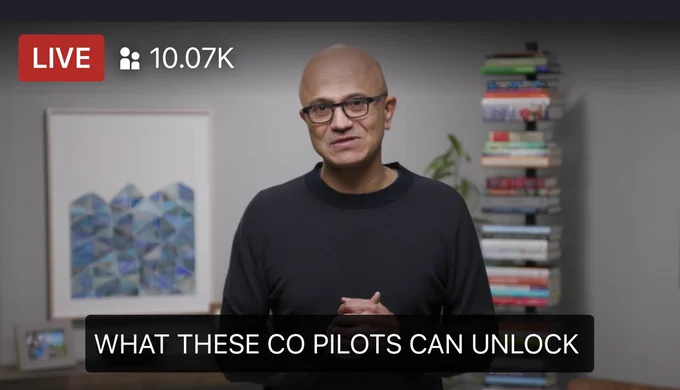 Satya Nadella in front of his bookshelf